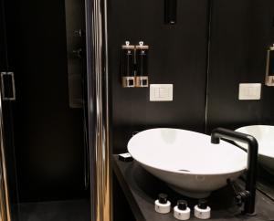 a bathroom with two sinks and a shower at Jb Relais Luxury in Rome