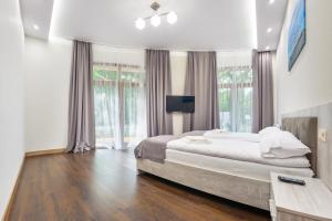 Posteľ alebo postele v izbe v ubytovaní Apartamenty Cypel Helski