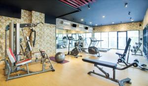 a gym with several exercise bikes and treadmills at Ibis Budget Jakarta Daan Mogot in Jakarta