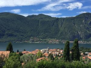 a view of a town in front of a lake at Villa Monte Bianco in Mandello del Lario