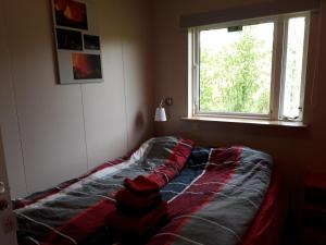 En eller flere senge i et værelse på Skyggnir Bed and Breakfast