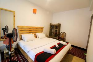 Postel nebo postele na pokoji v ubytování Easy Homes - Ashok Stupa + 23 fotografií