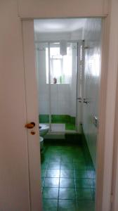 a bathroom with a shower and a sink and a toilet at La Favola di San Pietro in Rome