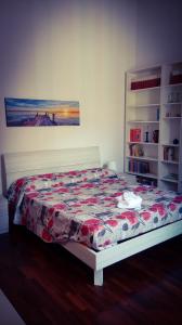 a bedroom with a bed with a quilt on it at La Favola di San Pietro in Rome