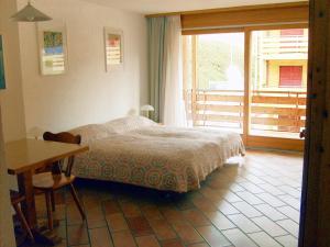 Postel nebo postele na pokoji v ubytování Résidence Castel Club Leysin Parc