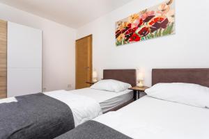 Ein Bett oder Betten in einem Zimmer der Unterkunft Villa Neda