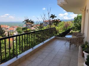 a balcony with a table and chairs and a view at Small apartment, great view! in Veria