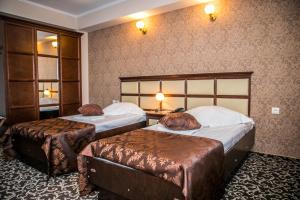 Postel nebo postele na pokoji v ubytování Hotel Megalos + 37 fotografií