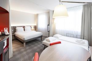 Voodi või voodid majutusasutuse Novotel Suites Genève Aéroport toas