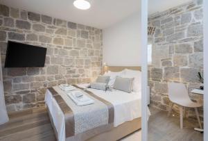 Posteľ alebo postele v izbe v ubytovaní Mediterra Residence