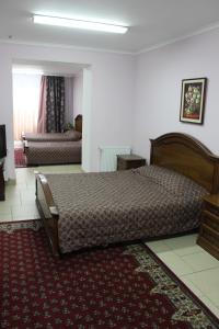 a bedroom with a bed and a television in it at Мини готель in Ternopil