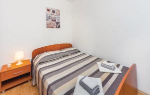 Postel nebo postele na pokoji v ubytování Apartment Rabac