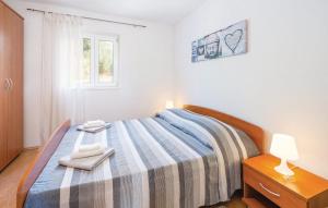 Postel nebo postele na pokoji v ubytování Apartment Rabac
