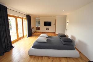 a bedroom with a large bed with pillows on it at Craig Alvah Lodge in Banff