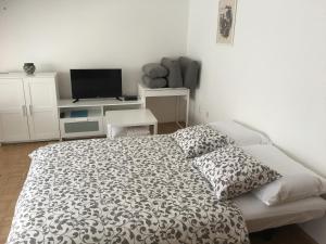 Postel nebo postele na pokoji v ubytování Apartmani ORION - Sunce