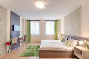 Posteľ alebo postele v izbe v ubytovaní Triple M Hotel