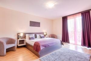 Posteľ alebo postele v izbe v ubytovaní Triple M Hotel
