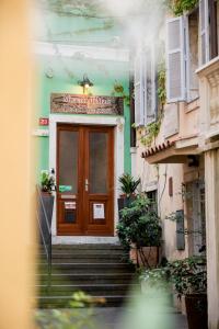 a entrance to a building with a wooden door at Miracolo di Mare Retro in Piran +20 photos
