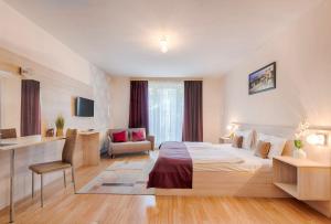 Posteľ alebo postele v izbe v ubytovaní Triple M Hotel