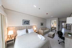 Rúm í herbergi á Asuncion Rent Suites Centro