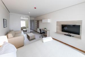 TV a/nebo společenská místnost v ubytování Asuncion Rent Suites Centro