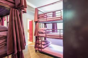 a group of bunk beds in a room at Safestay London Kensington Holland Park in London