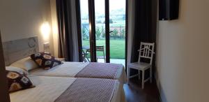 Кровать или кровати в номере La Mediana Del Sella