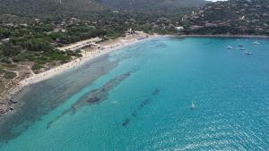 an aerial view of a beach with boats in the water at Helios Rooms in Flumini di Quartu
