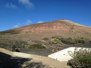 a large hill with a mountain in the background at Patio I in La Asomada