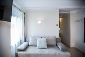 a living room with a couch and a window at Villa Baltica in Świnoujście