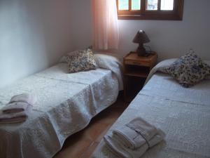 En eller flere senge i et værelse på Flor de Lis