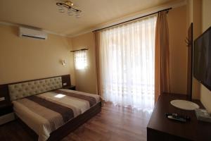 Postel nebo postele na pokoji v ubytování Casa Camelia Felix