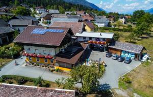 an overhead view of a house with solar panels on its roof at Hotel Beim Winkler in Tröpolach