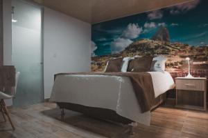 Voodi või voodid majutusasutuse HOTEl PACHAMAMA SPA toas