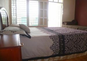 
A bed or beds in a room at Casa Bella Vista BARACOA
