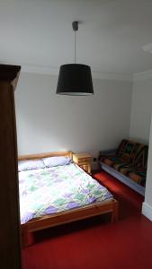 Łóżko lub łóżka w pokoju w obiekcie Pokoje dom Gustaw Augustów
