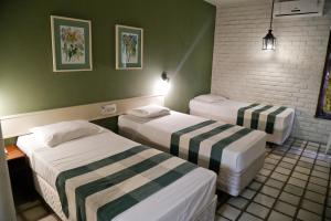 Cama o camas de una habitación en Hotel Casa Grande Gravatá