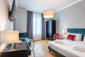 a hotel room with two beds and a lamp at 3110 ArtHotel in Florence