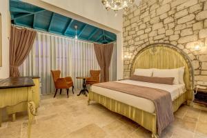 Postel nebo postele na pokoji v ubytování Bel Canto Alaçatı Hotel