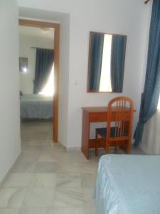 Posteľ alebo postele v izbe v ubytovaní Hostal Centro Sol