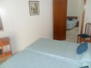 Posteľ alebo postele v izbe v ubytovaní Hostal Centro Sol