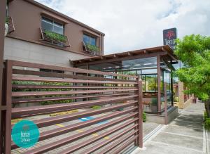 a wooden fence in front of a building at Hotel Terra Viva in Quesada