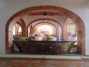 
a large room with a large tub in it at Hotel Rosita in Puerto Vallarta
