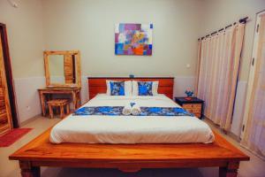 Ein Bett oder Betten in einem Zimmer der Unterkunft Villa Matahari