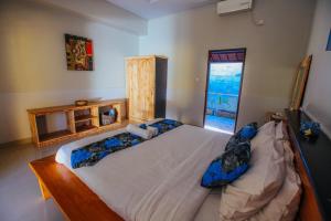 Ein Bett oder Betten in einem Zimmer der Unterkunft Villa Matahari