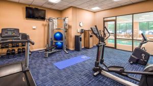 a fitness room with exercise equipment and a swimming pool at Best Western Plus BWI Airport Hotel - Arundel Mills in Elkridge