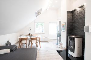 a living room and dining room with a table and chairs at Haus Sybille in Pölich
