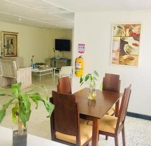 TV a/nebo společenská místnost v ubytování Hotel Casa Telma