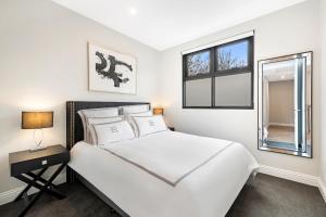 Ένα ή περισσότερα κρεβάτια σε δωμάτιο στο Manhattan Apartments - Caulfield North