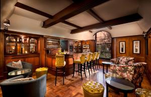 The lounge or bar area at The Manor House at Fancourt